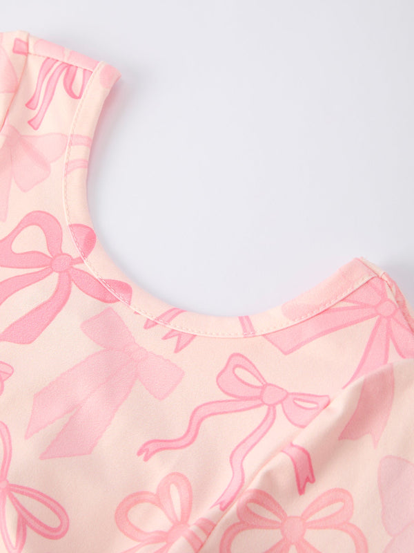 Girls pink bow print long sleeve jumpsuit, stylish and comfortable for infants, shown from angle 5.