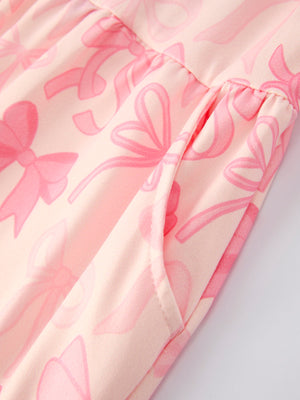 Girls pink bow print long sleeve jumpsuit, angle 3 view, perfect for stylish baby outfits.