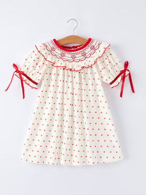 Valentine's Day polka dot girls' dress with smocking embroidery, perfect for festive occasions.