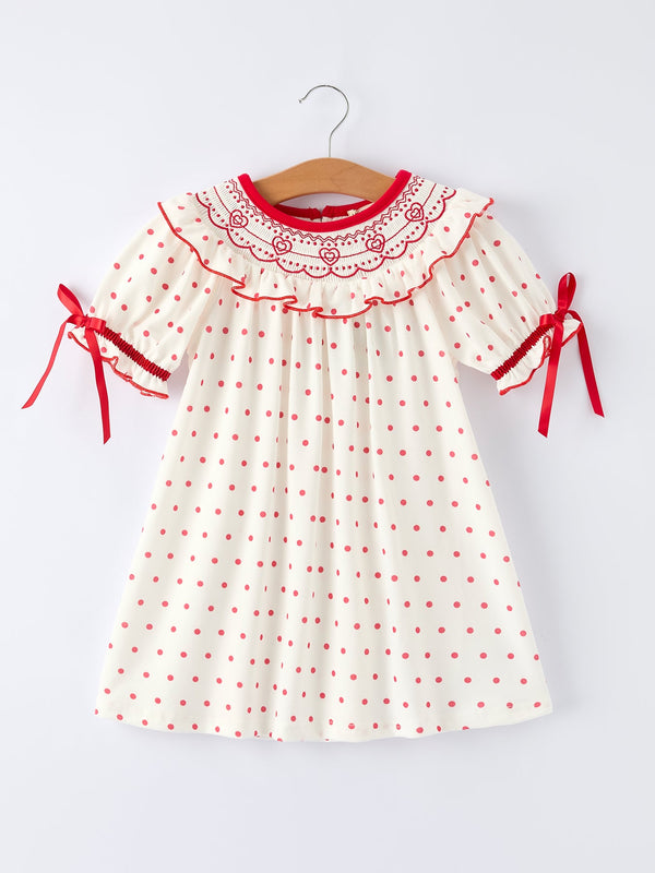 Valentine's Day polka dot girls' dress with smocking embroidery, perfect for festive occasions.