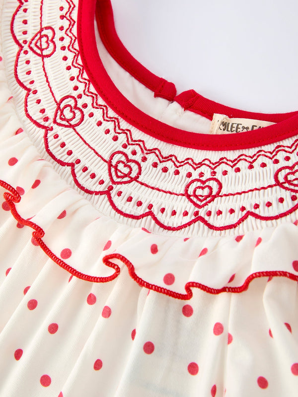 Valentine's Day polka dot girls' dress with smocking embroidery, shown from angle 3. Perfect for festive occasions!