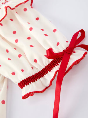 Valentine's Day polka dot girls' dress with smocking embroidery, shown from angle 4. Perfect for festive occasions!