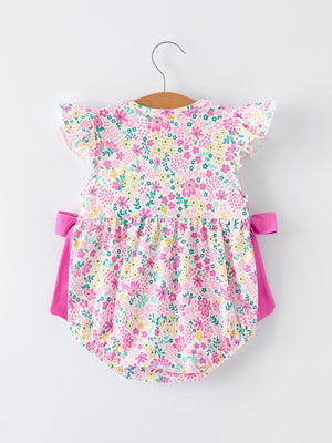 Easter floral bunny bow romper for baby girls, featuring colorful smocking embroidery, angle view.