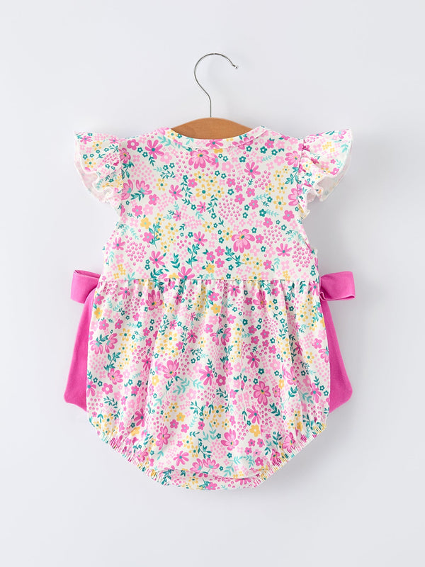 Easter floral bunny bow romper for baby girls, featuring colorful smocking embroidery, angle view.