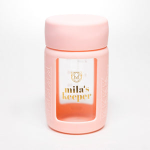 Set of 2 glass breast milk bottles at a 37-degree angle, perfect for safe storage and feeding.