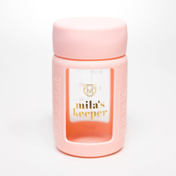 Set of 2 glass breast milk bottles at a 37-degree angle, perfect for safe storage and feeding.