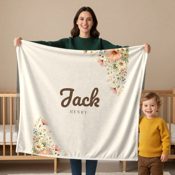 Wildflower toddler minky blanket in cream, held by a mom