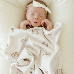 Soft Minky Stretch Receiving Blankets in a cozy angle, perfect for swaddling and keeping your baby warm.