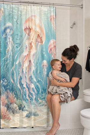 Mom holding her baby on the tub edge next to the Jellyfish Garden Ocean shower curtain