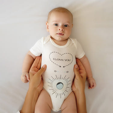 "Massage Me! Onesie for babies 0-6 months, soft and cozy design for comfort and style."