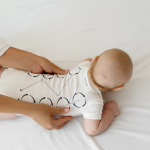 "Massage Me! Onesie for babies 0-6 months, soft fabric, playful design, perfect for comfort and style."