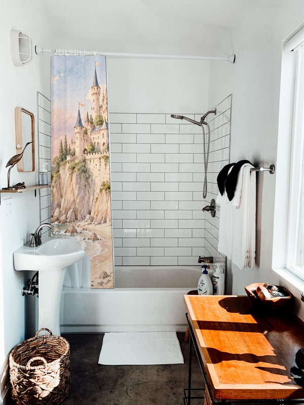 Seaside Castle Fairy Tale shower curtain hanging on the rod over a white bathtub