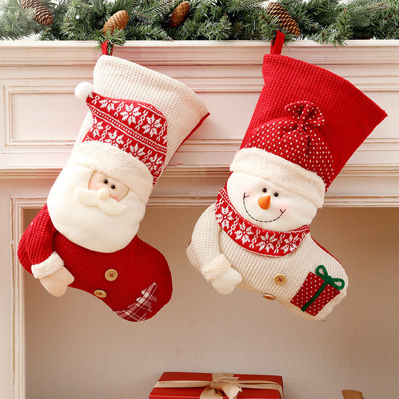 Knitted Christmas stocking featuring Santa design, perfect for festive baby decor and holiday celebrations.