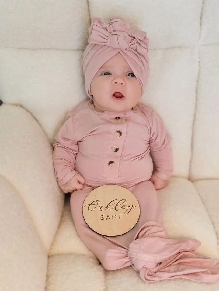 Newborn knotted gown and bow turban hat set in dusty rose for stylish baby outfits.
