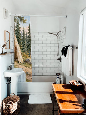 Bear Tent Sunrise Camping shower curtain hanging on the rod over a white bathtub
