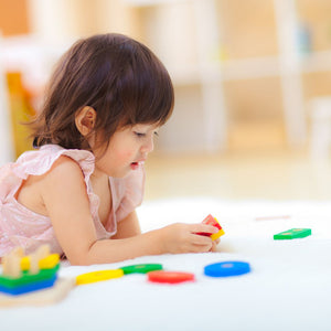 Geometric sorting board for babies, promoting early learning and sensory play, viewed from angle 2.