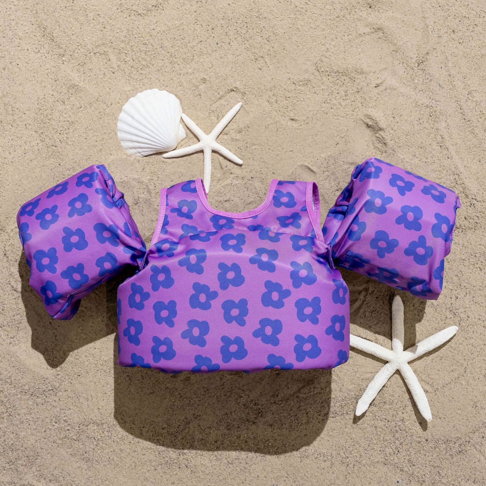 Purple Flower Power Kids Float for fun and safety in the water. Perfect for summer adventures!