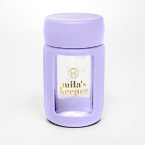 Set of 2 glass breast milk bottles at angle 58, perfect for safe breast milk storage.