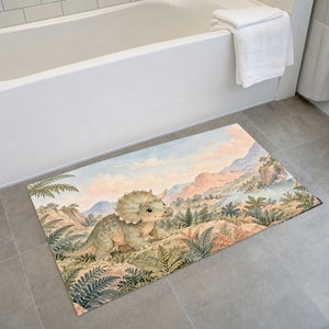 Baby Triceratops Dinosaur bath mat on the floor in front of the tub