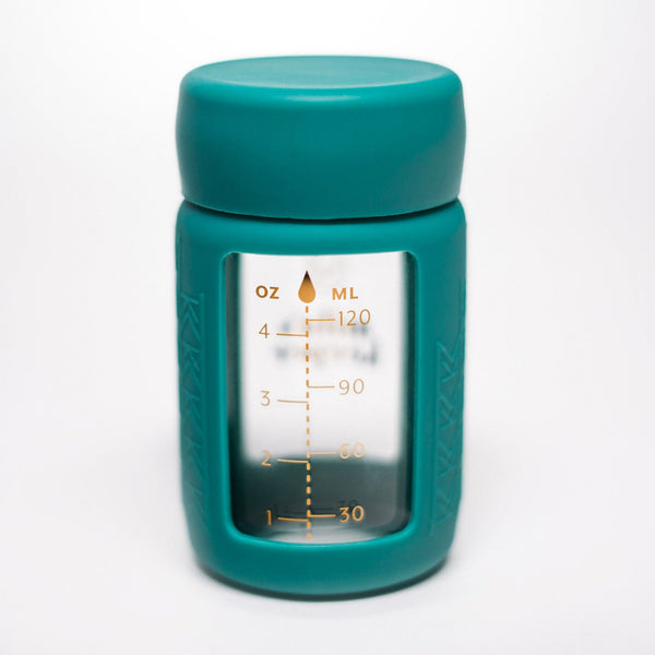 Set of 2 glass breast milk bottles at a 35-degree angle for safe and stylish milk storage.
