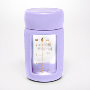 Set of 2 glass breast milk bottles at angle 59, perfect for safe and stylish breast milk storage.