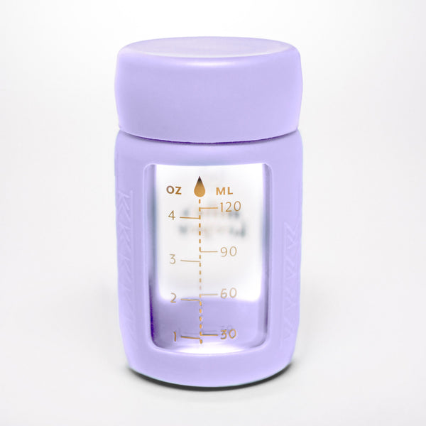 Set of 2 glass breast milk bottles at angle 59, perfect for safe and stylish breast milk storage.