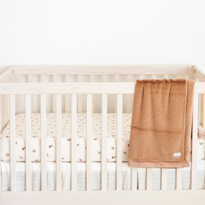 Minky Stretch Luxe crib sheets in soft fabric, angled view showcasing premium quality and comfort for babies.