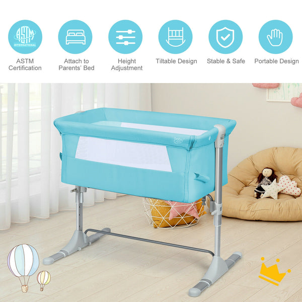 Travel portable baby bed side sleeper bassinet crib with carrying bag, angled view showcasing design and portability.