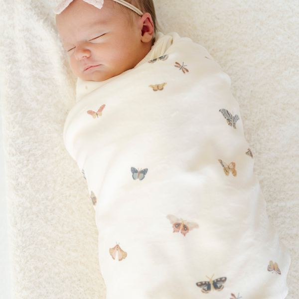 Minky Stretch Luxe Swaddle Blanket in soft fabric, perfect for keeping your baby cozy and comfortable.