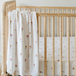 Minky Stretch Luxe Crib Sheets in soft fabric, angled view showcasing stylish design for a cozy nursery.