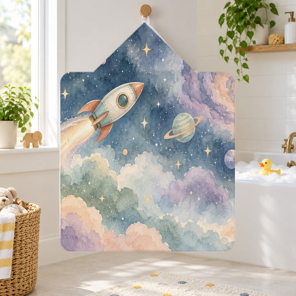 Rocket Journey kids hooded bath towel hanging in a kids bathroom