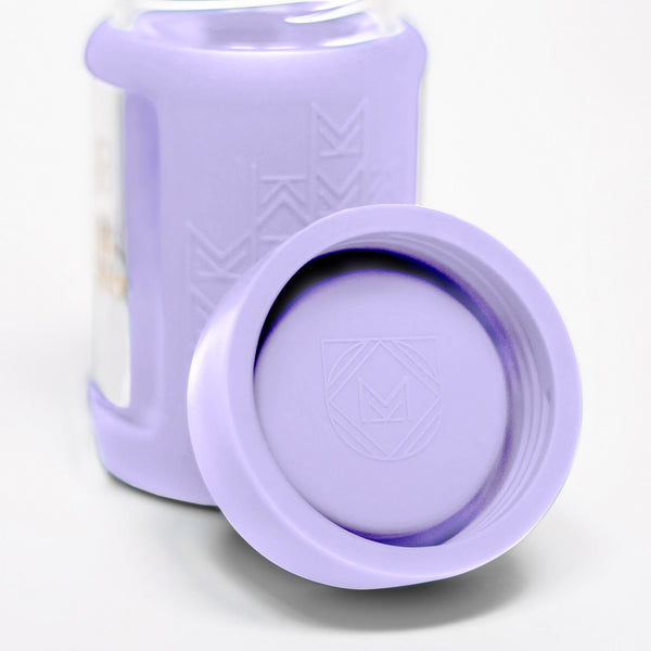 Set of 2 glass breast milk bottles at angle 61, perfect for safe breast milk storage.