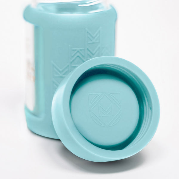 Set of 2 glass breast milk bottles at angle 53, perfect for safe breast milk storage.