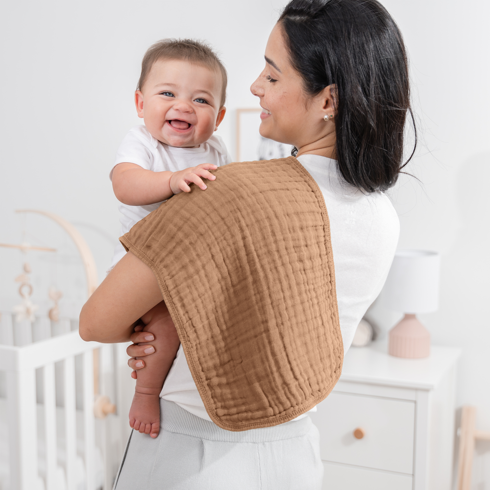 Multicolor muslin burp cloths for babies, soft and absorbent, perfect for feeding and messes.