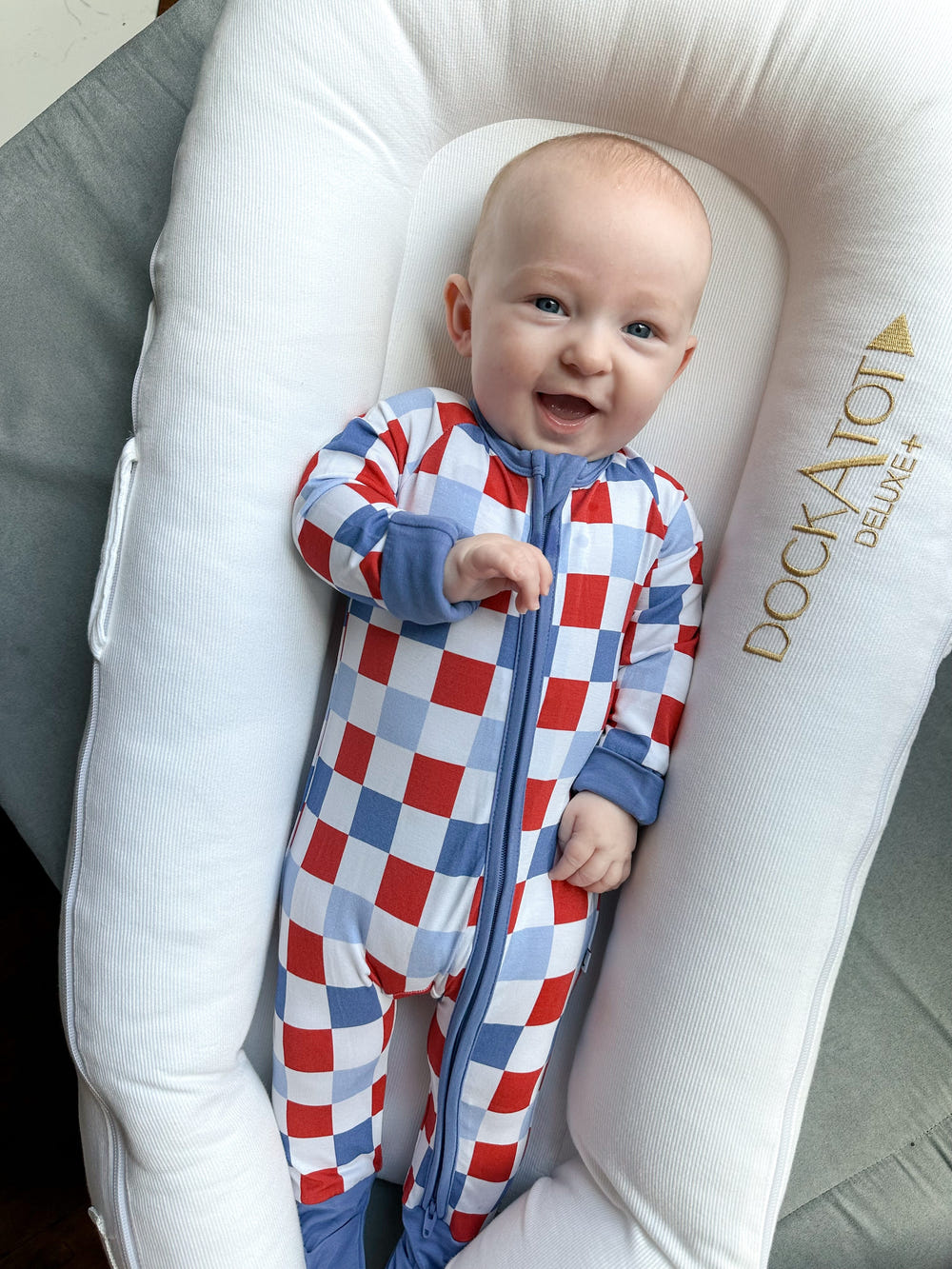 RWB Check Zippy baby bedding for cozy sleep, featuring a stylish red, white, and blue checkered design.