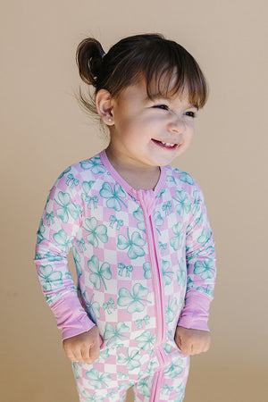 Bamboo Zip Romper in Shamrock & Bows design, showcasing a stylish angle view for babies.
