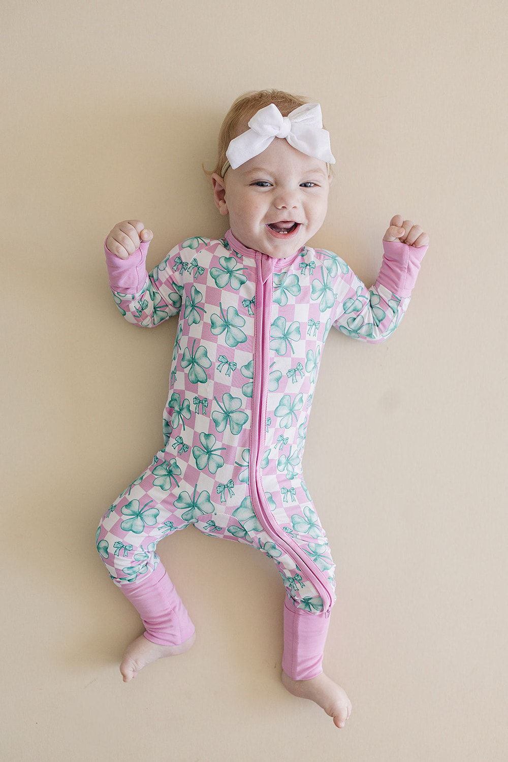 Bamboo Zip Romper in Shamrock & Bows design for babies, featuring soft fabric and stylish comfort.