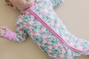 Bamboo Zip Romper in Shamrock & Bows design, angled view showcasing soft fabric and stylish details for babies.