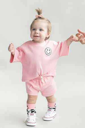 Smiley Shorts Set in Pink Peach for babies, featuring a cute design and comfortable fit.