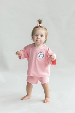 Smiley Shorts Set in Pink Peach for babies, showcasing playful design from angle 7.