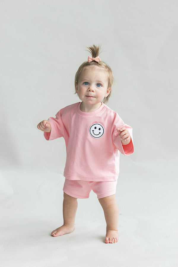Smiley Shorts Set in Pink Peach for babies, showcasing playful design from angle 7.