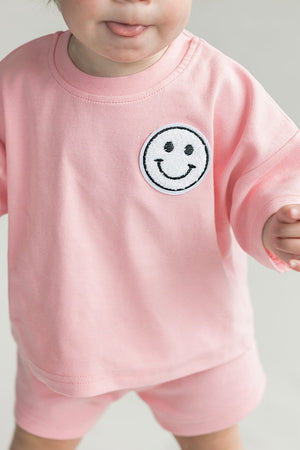 Smiley Shorts Set in Pink Peach for babies, showcasing playful design from angle 5. Perfect for summer outfits!