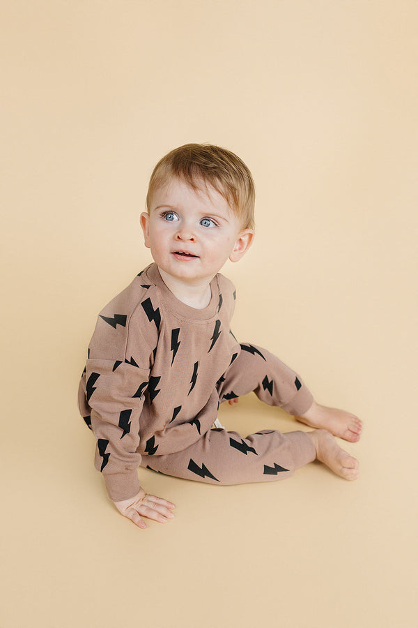 Baby jogger set in mocha bolts, stylish and comfortable lounge wear for infants, shown from angle 3.