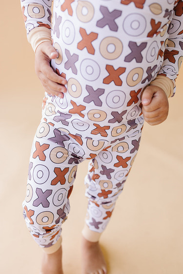 Bamboo two-piece romper set for babies by Xoxo, featuring soft, breathable fabric and adorable design.