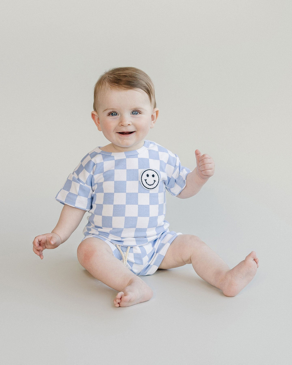 Blue checkered shorts set for babies, perfect for stylish summer outfits.