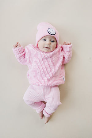 Pink chunky knit sweater for babies, cozy and stylish, displayed at angle 9. Perfect for chilly days!