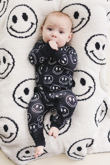 Smiley Fuzzy Blanket in black, soft plush fabric perfect for keeping babies cozy and warm.