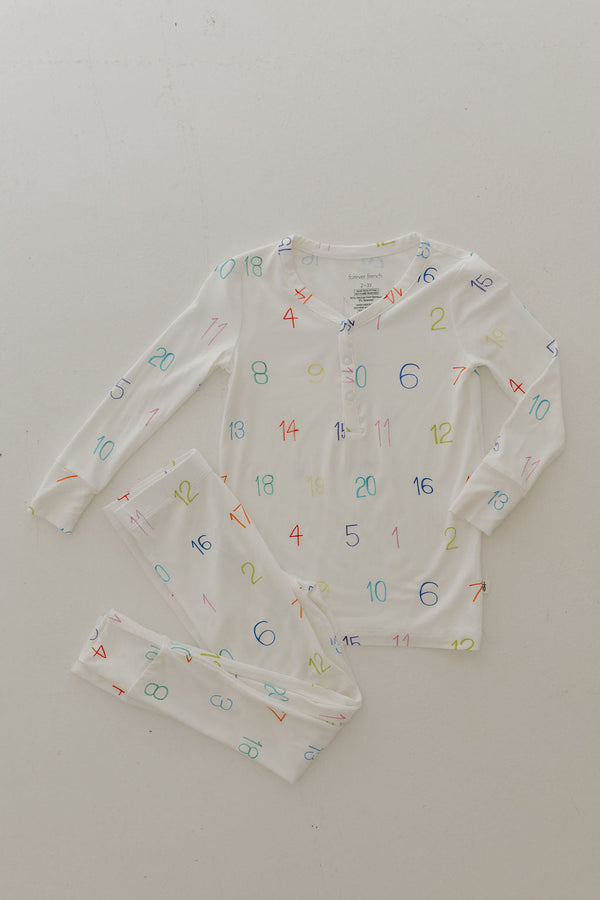Bamboo two-piece pajamas for babies, featuring Autism Awareness design by Charli Counts, shown at angle 5.