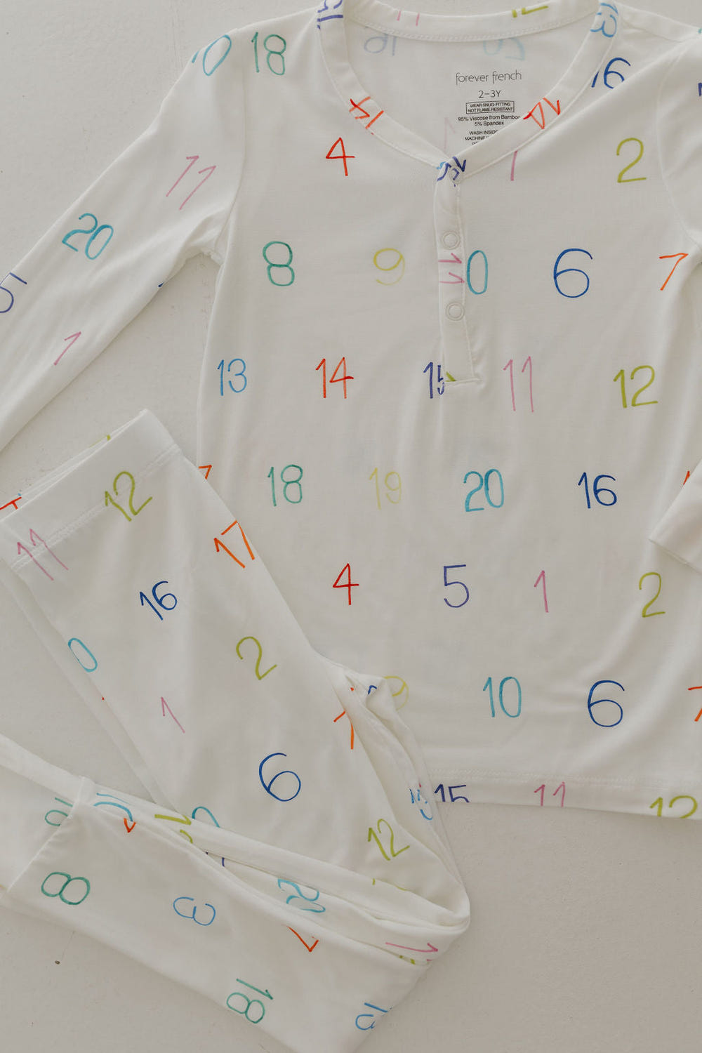 Bamboo two-piece pajamas for babies, featuring Autism Awareness design by Charli Counts. Soft and comfortable sleepwear.