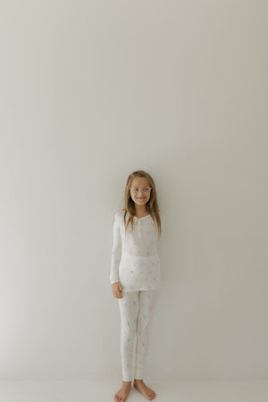 Bamboo two-piece pajamas for kids, featuring Autism awareness design by Charli Counts, shown at angle 4.